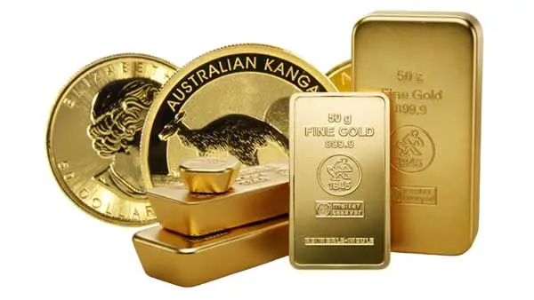 Münzen & Barren Anlagemünzen wie Krügerrand und geprägte Goldbarren gestapelt