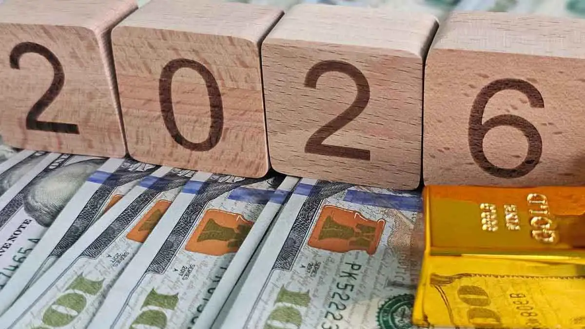 Goldbarren, Geldscheine und Holzwürfeln mit der Beschriftung 2026